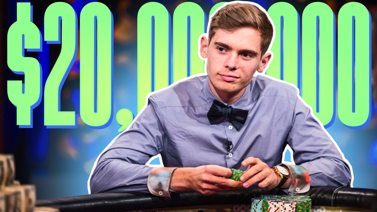 Poker phenom Fedor Holz sits at a poker table wearing a blue button down shirt and bowtie, holding poker chips, with a slight smirk, displaying the kind of confidence only a high roller tournament player of his stature could have.