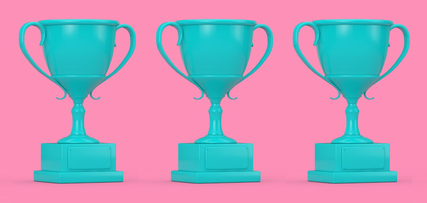 3 blue trophies on a pink background