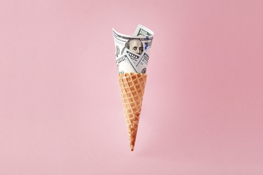 a waffle ice cream cone in front of a pink background. in the cone, instead of ice cream is money. PokerStars US SCOOP Scoops Up Success, Breaks Guarantees