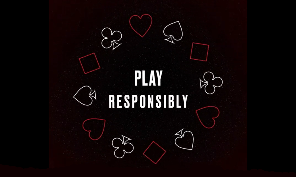 screenshot of PokerStars USA responsible gaming ad. black background with red and white outlines of hearts, spades, clubs, and diamonds, with the words play responsibly in the middle. 